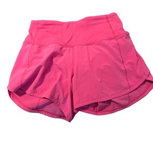 Sped up mid rise 4” lululemon shorts in hot pink; size 2.